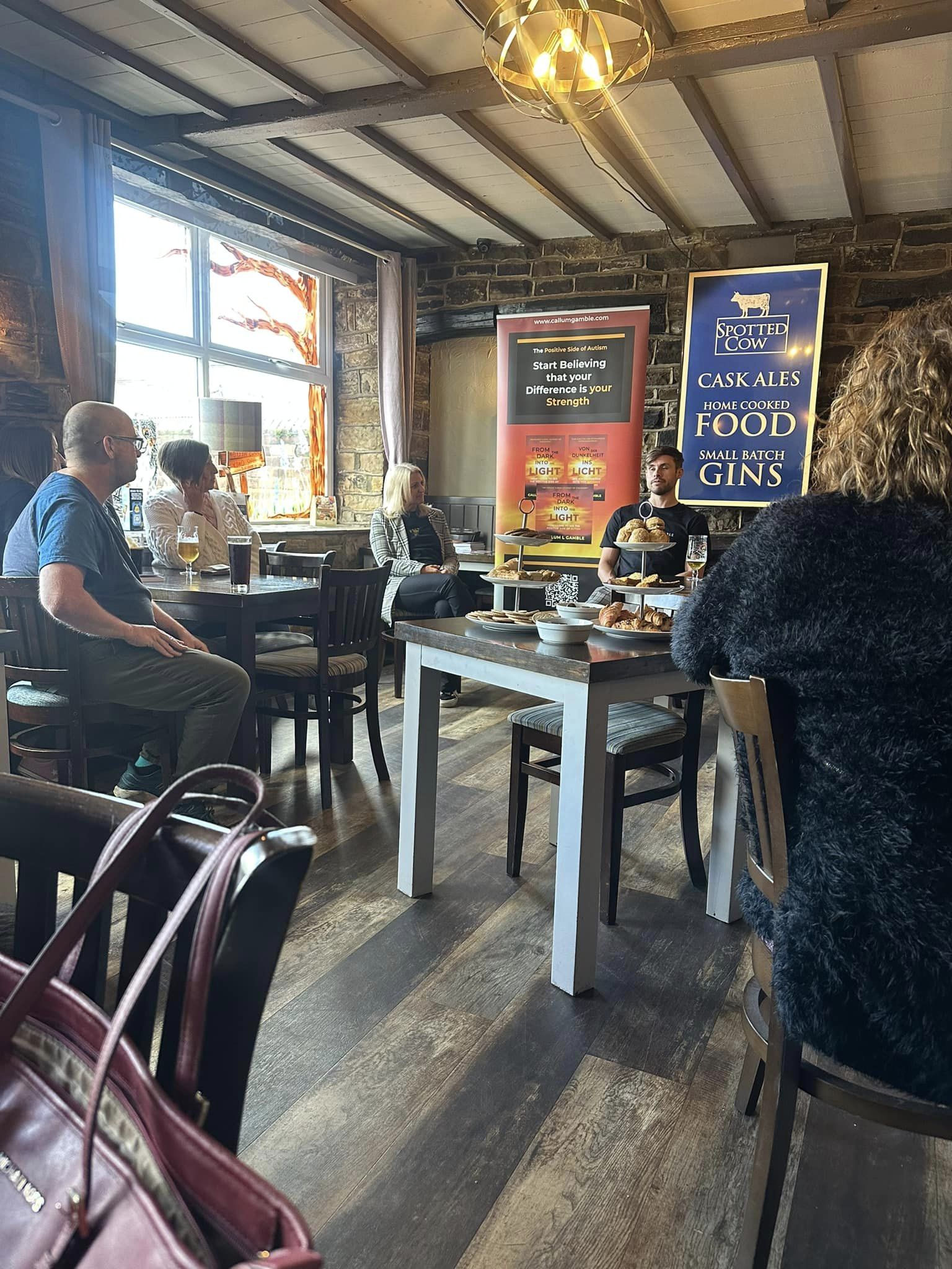 News page: the Callum L Gamble team presenting at the Spotted Cow